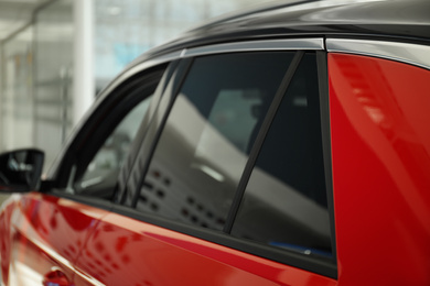 Modern car with tinting foil on window, closeup