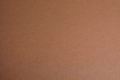 Brown sheet of cardboard as background, closeup