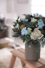 Beautiful wedding winter bouquet on wooden rack indoors