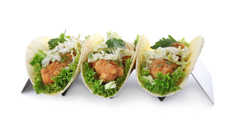 Photo of Yummy fish tacos in holder isolated on white
