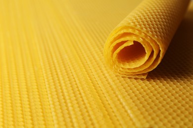 Photo of Natural organic beeswax sheets, closeup. Space for text