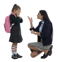 Teacher pointing on wrist watch while scolding pupil for being late against white background
