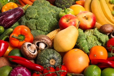 Assortment of fresh organic fruits and vegetables as background, closeup