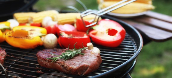 Image of Cooking meat and vegetables on barbecue grill outdoors, closeup. Banner design