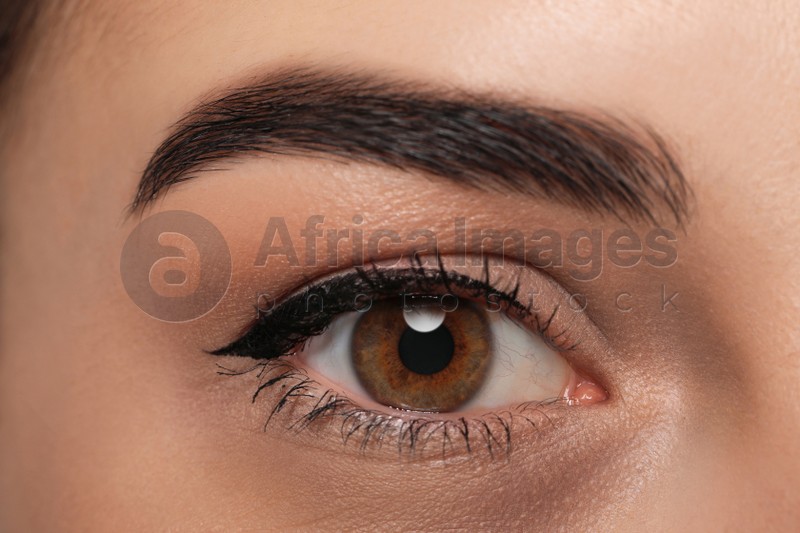 Tired young woman with dark circle under eye, closeup