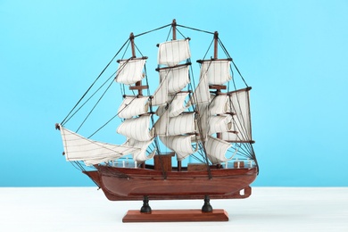 Photo of Beautiful ship model on white wooden table