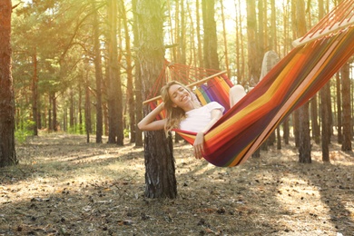Photo of Woman resting in hammock outdoors on summer day
