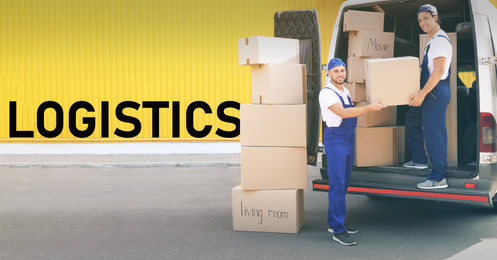 Logistics concept. Men unloading boxes from van 