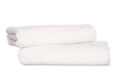 Folded soft terry towels on white background