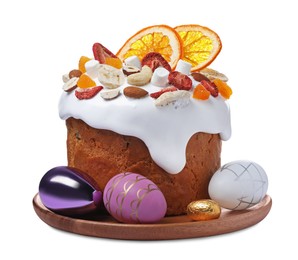 Photo of Traditional Easter cake with dried fruits and decorated eggs isolated on white