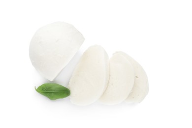 Delicious mozzarella cheese slices and basil on white background, top view