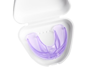 Photo of Container with transparent dental mouth guard isolated on white, top view. Bite correction