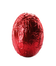 Chocolate egg wrapped in bright red foil isolated on white