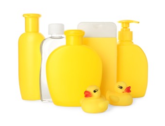 Photo of Set of baby cosmetic products and rubber ducks on white background