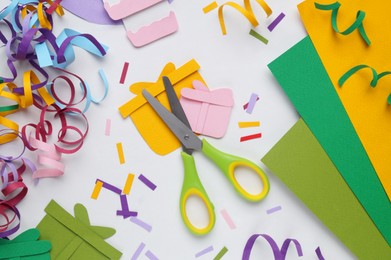 Photo of Flat lay composition with stationery, confetti and paper gift boxes on white background
