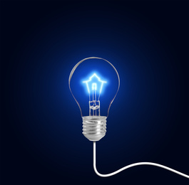 Light bulb with tungsten filament in shape on house on dark background. Energy efficiency, loan, property or business idea concepts