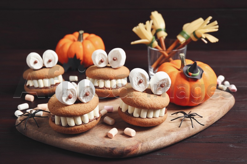 Delicious Halloween themed desserts on wooden table
