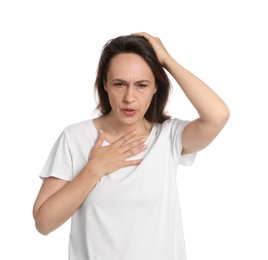 Mature woman suffering from breathing problem on white background