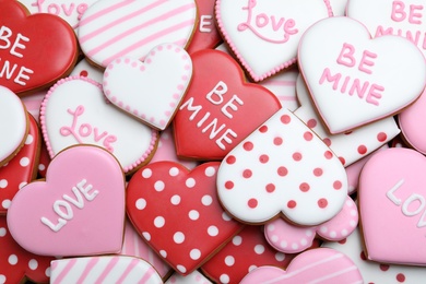 Delicious heart shaped cookies as background, top view. Valentine's Day