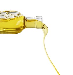 Photo of Pouring cooking oil from bottle on white background, closeup