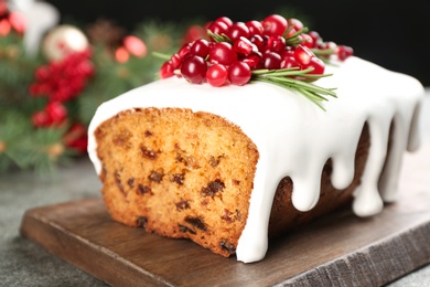 Traditional Christmas cake on grey table, closeup. Classic recipe
