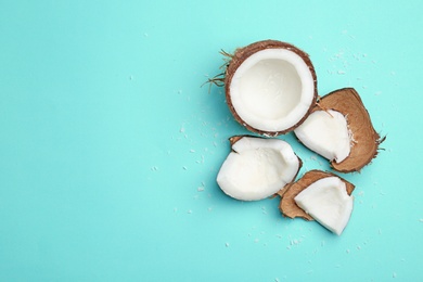 Composition with fresh coconut on color background, top view