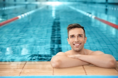 Young athletic man in swimming pool