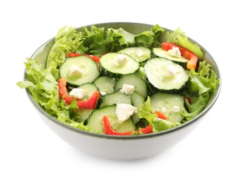 Delicious salad with cucumbers, red bell pepper and feta cheese in bowl isolated on white