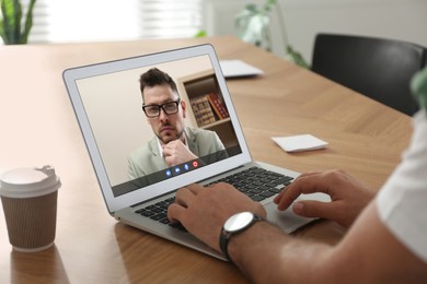 Man using laptop for online studying, closeup. Webinar concept