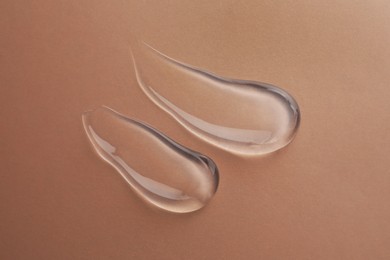 Sample of transparent gel on color background, top view