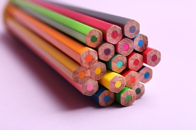 Different color pencils on light background, closeup