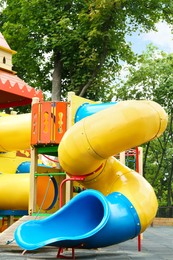 Photo of New colorful castle playhouse with slide on children's playground