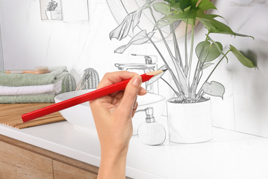 Woman drawing bathroom interior design. Combination of photo and sketch