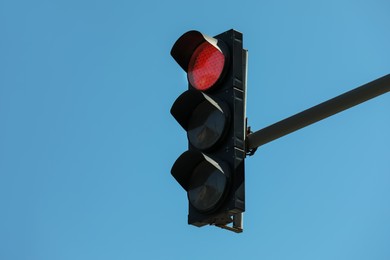 View of traffic light against blue sky