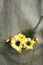 Woman wearing shirt with flowers in pocket, closeup