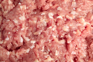 Raw chicken minced meat as background, top view