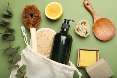 Flat lay composition with eco friendly products on green background