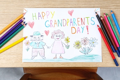 Beautiful drawing on wooden table, top view. Happy Grandparents Day