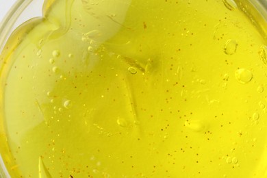 Photo of Yellow slime with glitter, closeup. Antistress toy