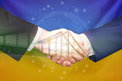 Double exposure of bridge and men shaking hands against Ukrainian national flag, closeup. International relationships