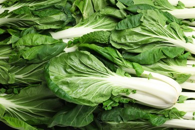 Fresh green pak choy cabbages as background, top view