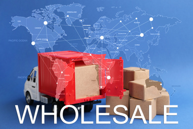 Image of Wholesale business. World map and truck model with carton boxes on background