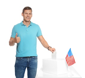 Man putting ballot paper into box against white background