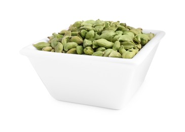 Photo of Ceramic bowl with dry cardamom isolated on white
