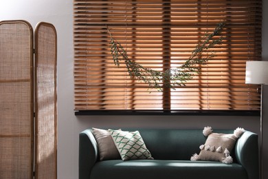 Stylish room decorated with beautiful eucalyptus garland