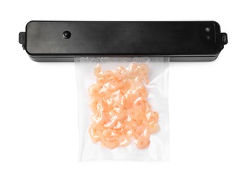 Vacuum packing sealer and plastic bag with shrimps on white background, top view