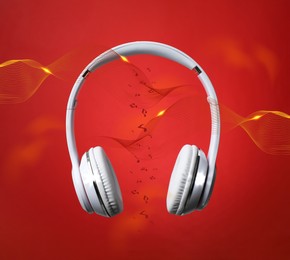 Modern headphones and illustration of dynamic sound waves on red background