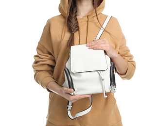 Young woman in casual outfit with stylish bag on white background, closeup