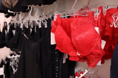 Many different beautiful women's underwear in lingerie store, closeup