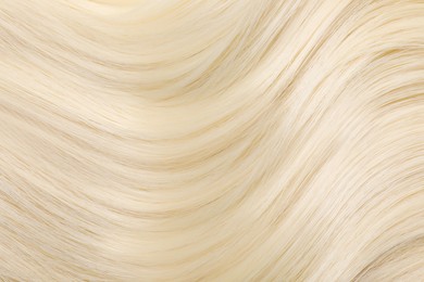 Beautiful blonde straight hair as background, closeup